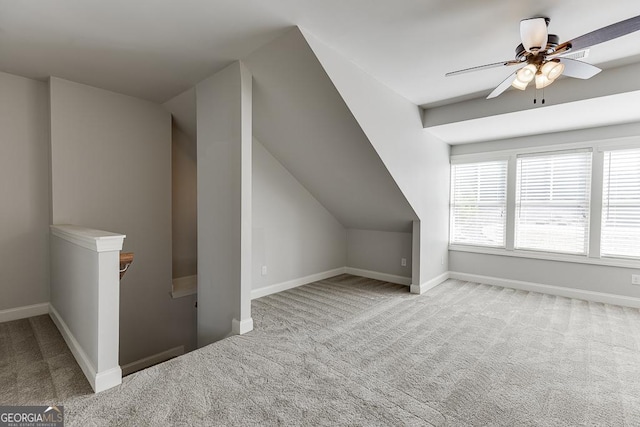 bonus room featuring carpet, baseboards, and ceiling fan