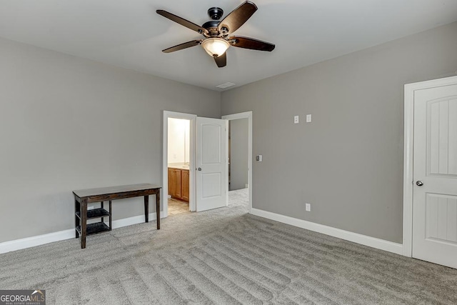 unfurnished bedroom with visible vents, baseboards, ceiling fan, and light colored carpet