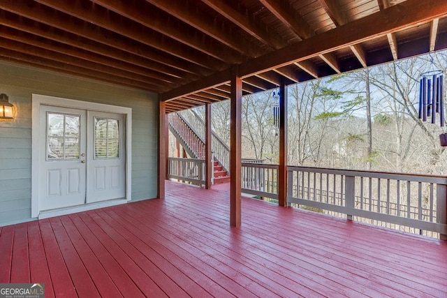 wooden terrace featuring stairs