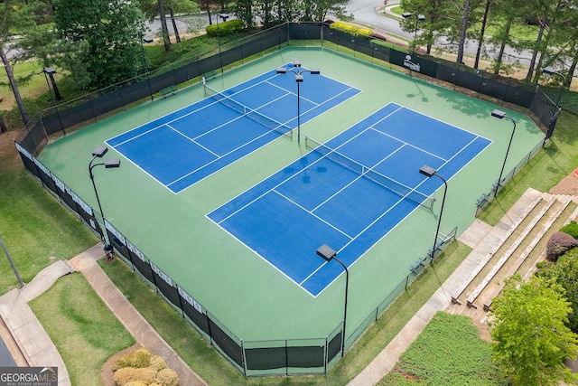 view of tennis court with fence