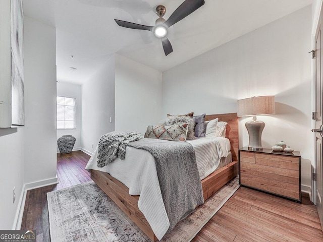 bedroom featuring hardwood / wood-style flooring and ceiling fan