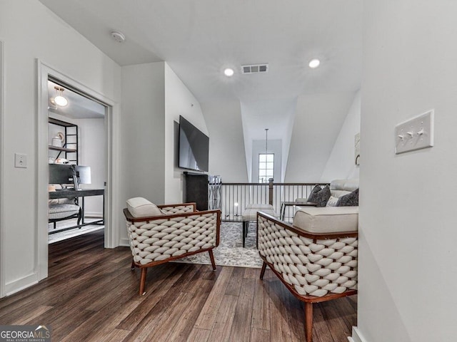 sitting room featuring dark hardwood / wood-style flooring