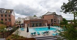 view of swimming pool with a patio