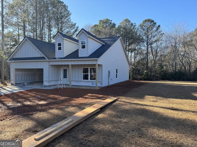 view of front of property with a garage and a porch