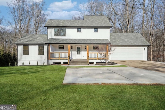 view of front of house with a porch, a garage, and a front yard