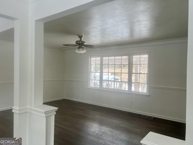 unfurnished room featuring ornamental molding, dark hardwood / wood-style floors, and ceiling fan