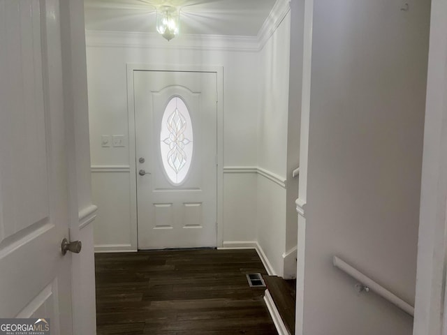 entryway featuring crown molding and dark hardwood / wood-style flooring