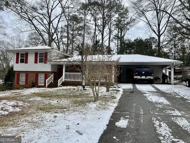 view of front of home featuring a carport and covered porch