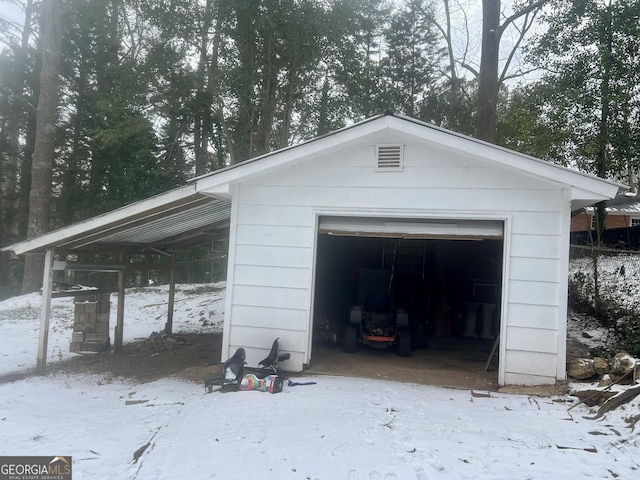 view of snow covered garage