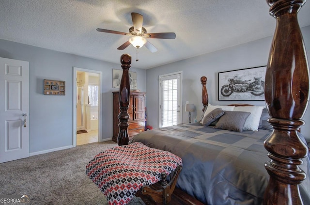 bedroom featuring ceiling fan, connected bathroom, light colored carpet, and a textured ceiling