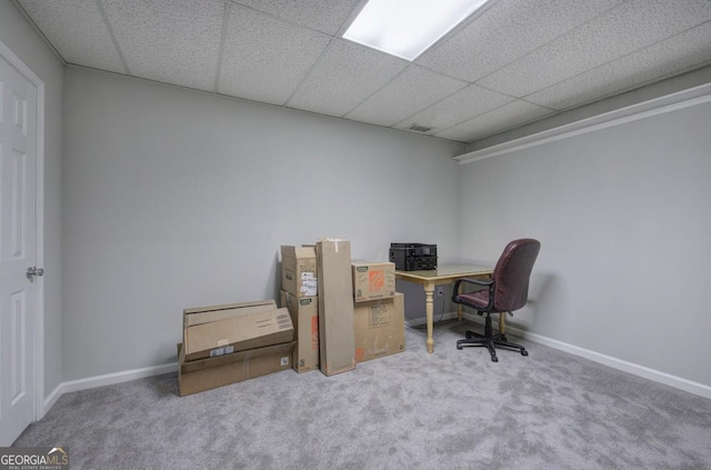 office space featuring carpet floors and a paneled ceiling