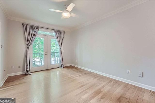 unfurnished room with ornamental molding, ceiling fan, light hardwood / wood-style floors, and french doors