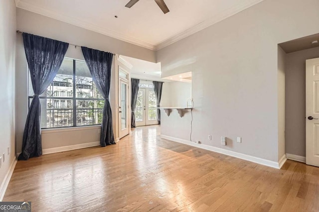 unfurnished room featuring ornamental molding, ceiling fan, and light hardwood / wood-style floors