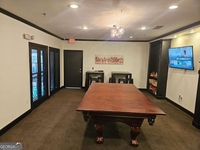 dining room featuring dark colored carpet and crown molding