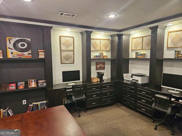 home office featuring crown molding, built in desk, light carpet, and ornate columns