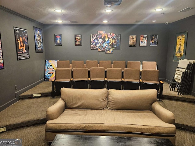 cinema featuring crown molding, carpet, and a textured ceiling