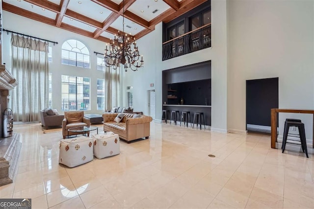 tiled living room featuring beam ceiling, coffered ceiling, an inviting chandelier, and a towering ceiling