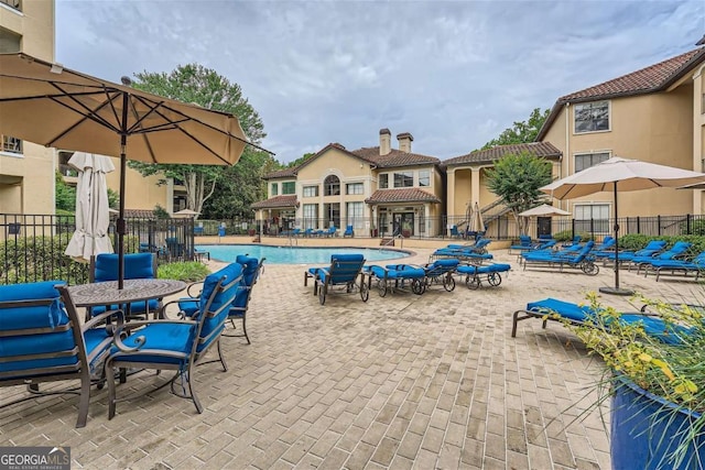 view of pool featuring a patio area