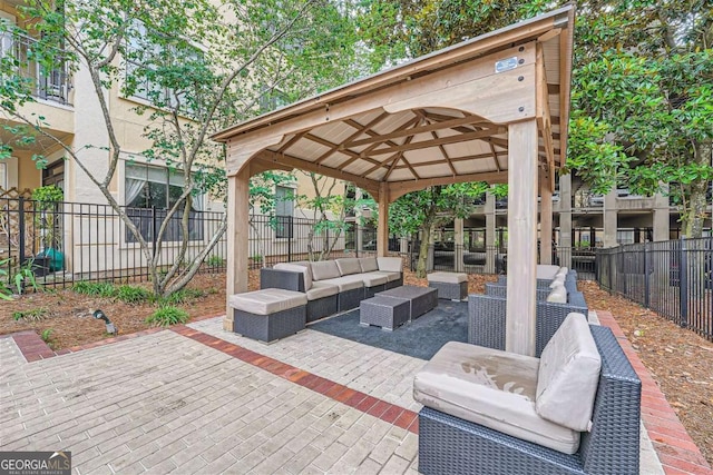 view of patio featuring an outdoor living space and a gazebo