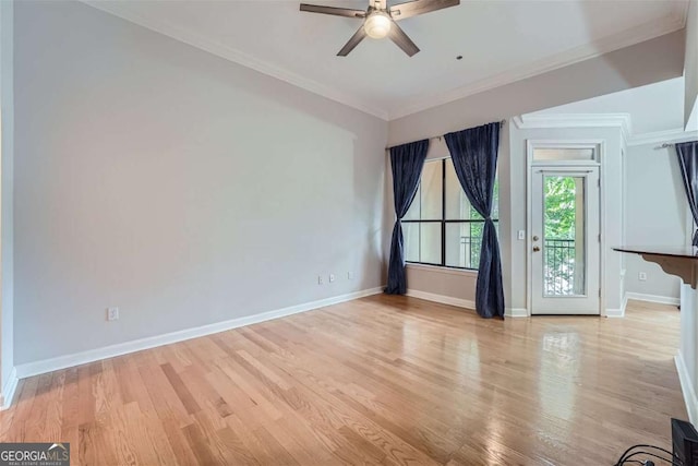 unfurnished living room with ceiling fan, ornamental molding, and light hardwood / wood-style floors