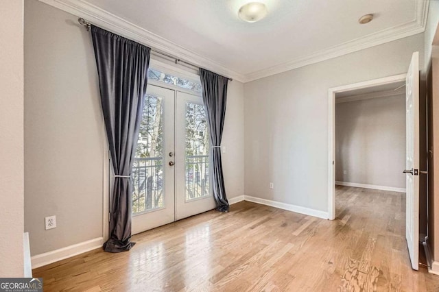 foyer entrance with crown molding, french doors, and a healthy amount of sunlight