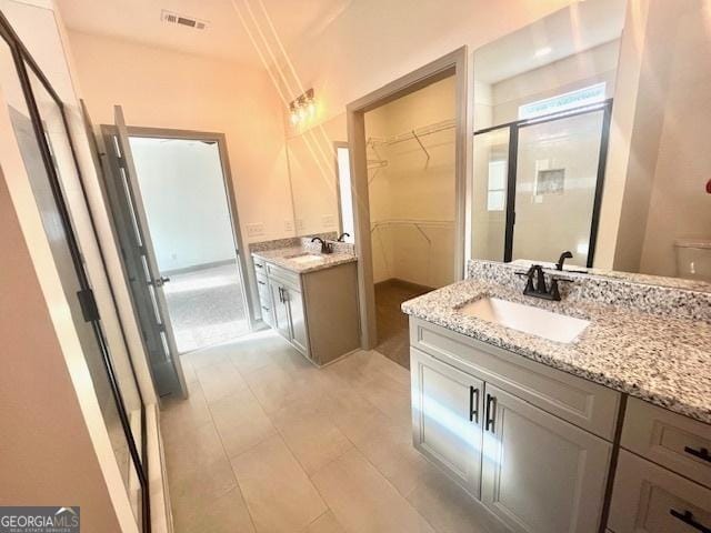 bathroom with vanity and walk in shower