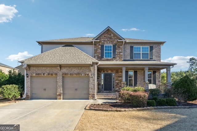 view of front of home with a garage and a porch