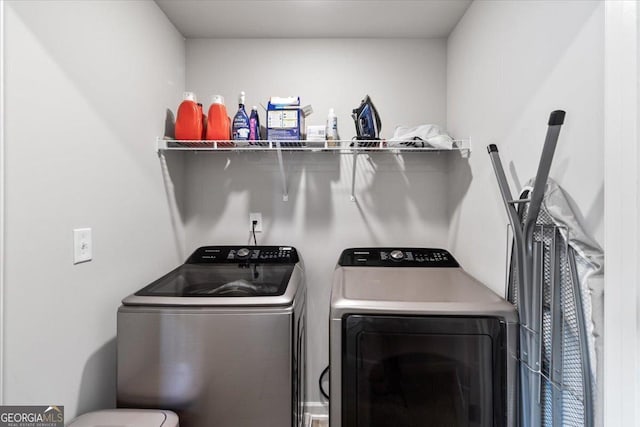 laundry area featuring washer and dryer and laundry area