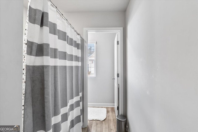 full bathroom with wood finished floors