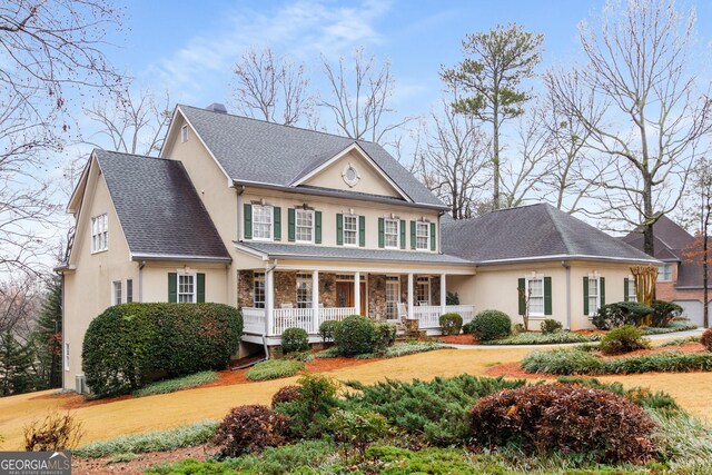 2290 Spencers Way, Stone Mountain, GA 30087 - view of front of home featuring a porch, stucco siding, and stone siding