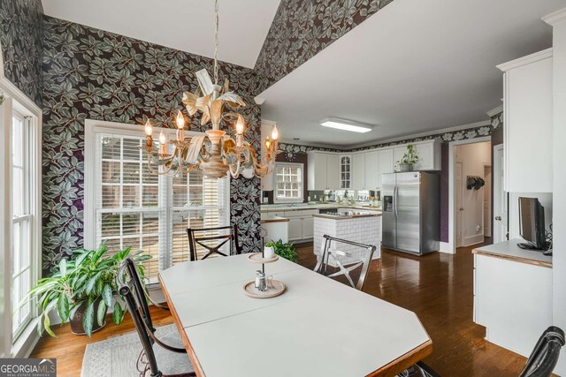 2290 Spencers Way, Stone Mountain, GA 30087 - dining space with wallpapered walls, a notable chandelier, and dark wood-type flooring