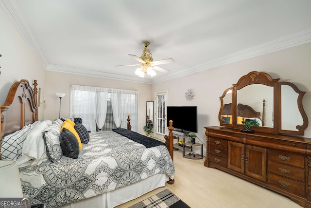 carpeted bedroom with ornamental molding and ceiling fan