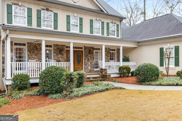 2290 Spencers Way, Stone Mountain, GA 30087 - entrance to property with covered porch, a shingled roof, stucco siding, and stone siding