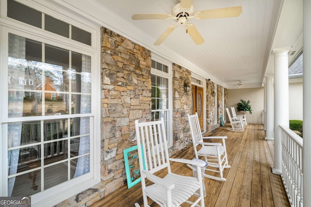 deck featuring ceiling fan and a porch