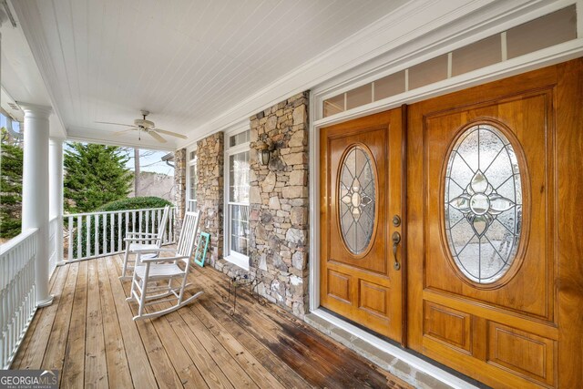 2290 Spencers Way, Stone Mountain, GA 30087 - property entrance featuring a porch, ceiling fan, and stone siding