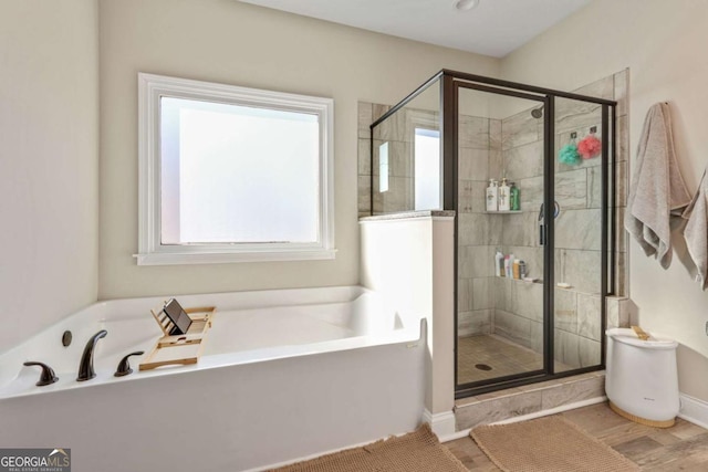 bathroom with shower with separate bathtub