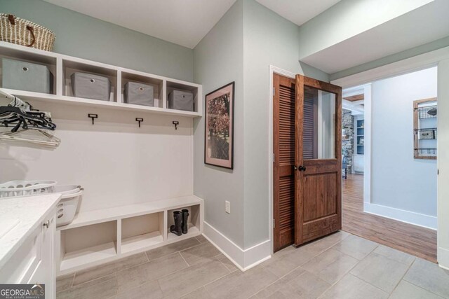 mudroom featuring light tile patterned flooring