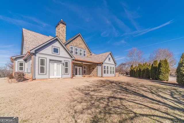 rear view of property featuring french doors