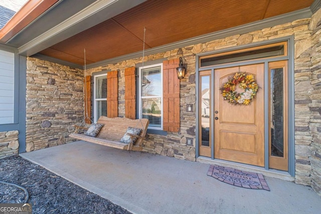 property entrance with covered porch