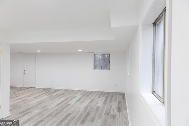 spare room with plenty of natural light and light wood-type flooring