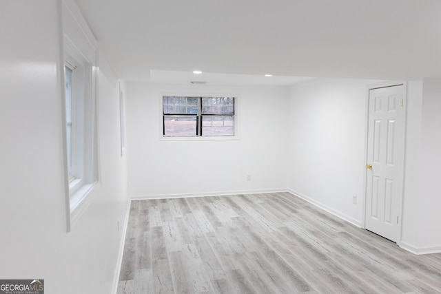 spare room featuring light hardwood / wood-style floors