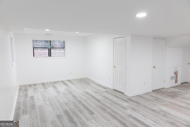 basement featuring light wood-type flooring