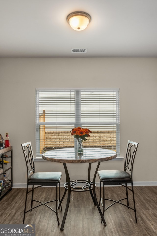 dining room with wood-type flooring