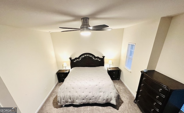 bedroom with ceiling fan and light carpet