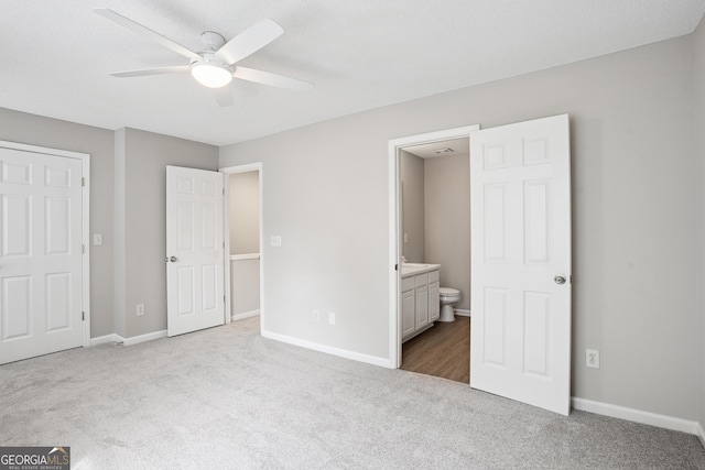 3742 Berkeley Xing, Duluth, GA 30096 - unfurnished bedroom with baseboards, ensuite bath, carpet flooring, and ceiling fan