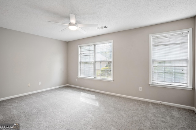 3742 Berkeley Xing, Duluth, GA 30096 - carpeted spare room with a textured ceiling, visible vents, baseboards, and ceiling fan