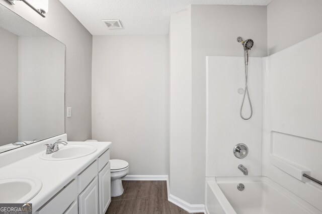 3742 Berkeley Xing, Duluth, GA 30096 - bathroom featuring toilet, wood finished floors, visible vents, and a sink