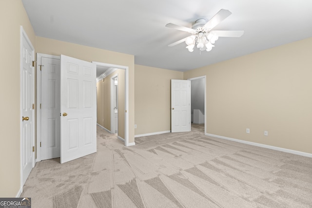 unfurnished bedroom with light carpet and ceiling fan