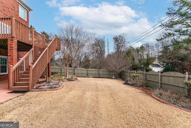 view of yard with a wooden deck