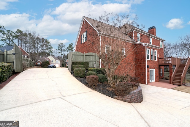 view of home's exterior featuring a deck